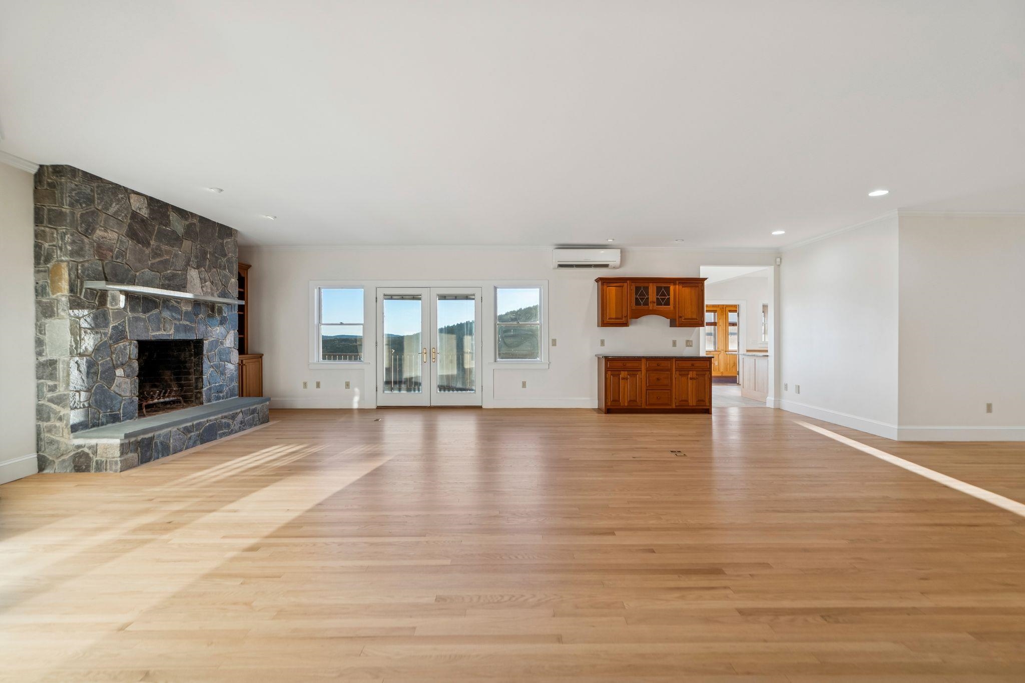 Living room facing glass doors to deck and kitchen